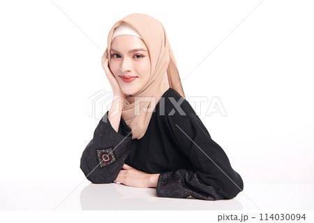 Beautiful young asian muslim woman wearing a beige hijab on white background, Portrait of Arab Beauty. 114030094