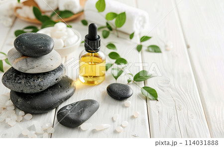 Beautiful spa composition with stones and oil bottles on wooden background 114031888
