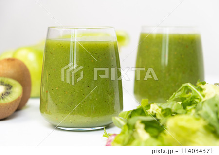 Healthy vegetable smoothie in glasses on white background. 114034371