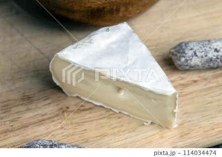 pieces of cream cheese with white mold 114034474