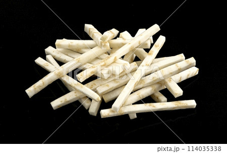 Chopped celery root isolated on black background Chopped celery root isolated on black background 114035338