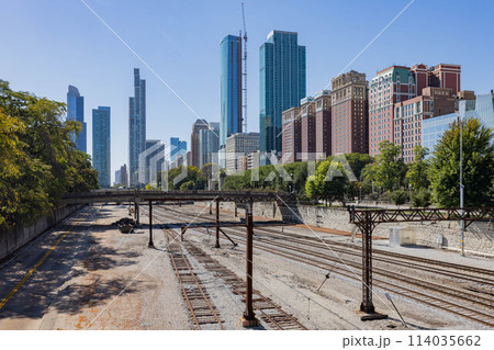 Sunny exterior view of the downtown cityscape with railway Sunny exterior view of the downtown cityscape with railway 114035662