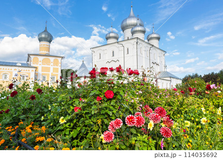 Decorative flowers against the background of the Orthodox church in the Khutynsky monastery in Veliky Novgorod, Russia. Selective focus Decorative flowers against the background of the Orthodox church in the Khutynsky monastery in Veliky Novgorod, Russia. Selective focus 114035692