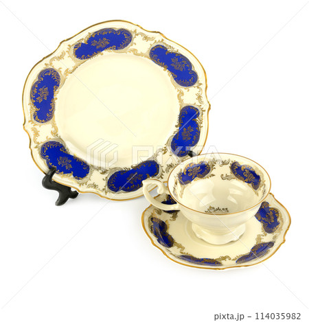 Vintage porcelain cups and saucer isolated on white. Vintage porcelain cups and saucer isolated on white. 114035982