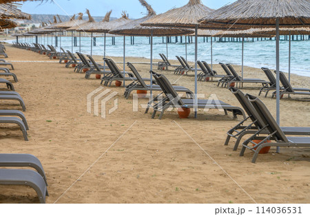Mediterranean beach with sun loungers and sun umbrellas 4 114036531