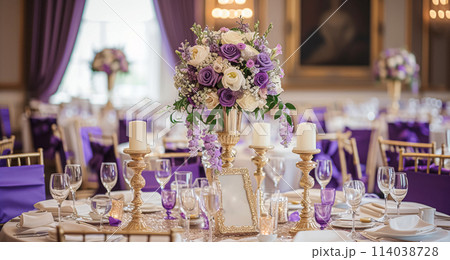 Wedding table decoration with lavender flowers, sweets, cake and candles 114038728