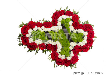 Funeral wreath of fresh flowers in the shape of a cross. Funeral wreath of fresh flowers in the shape of a cross. 114039897