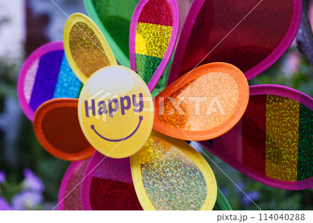 A colorful pinwheel with happy on the front A colorful pinwheel with happy on the front 114040288