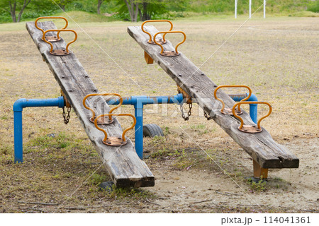 wooden see-saw on a playground wooden see-saw on a playground 114041361