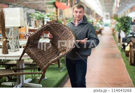 Man choosing new furniture in salon 114043268