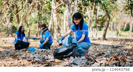 Group of volunteers, community members cleaning the nature from garbage and plastic waste to send it for recycling 114043798