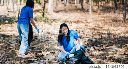 Group of volunteers, community members cleaning the nature from garbage and plastic waste to send it for recycling 114043801