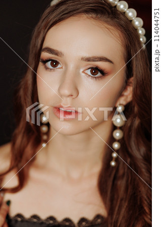 A woman with long brown hair A woman with long brown hair 114044751