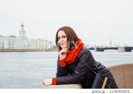looking away young pensive daydreaming happy female woman on city embankment of St. Petersburg. architect, interior designer, businesswoman. positive emotion, tourism, lifestyle portrait looking away young pensive daydreaming happy female woman on city embankment of St. Petersburg. architect, interior designer, businesswoman. positive emotion, tourism, lifestyle portrait 114046805