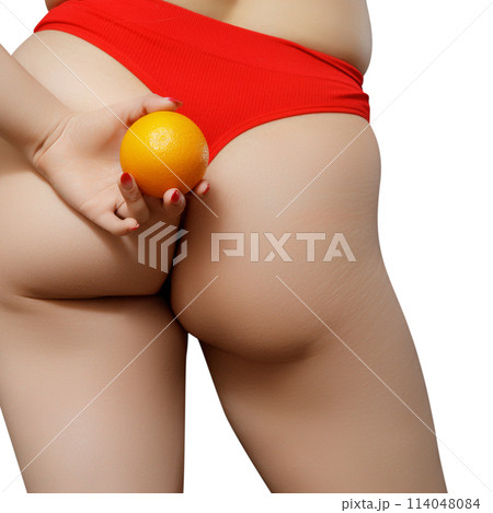 Young woman holding orange on light background Young woman holding orange on light background 114048084