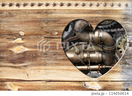 Retro background in steampunk style with heart-shaped hole in wooden boards and vintage metal machine details, pipeline, gear. Copy space for text. Can be used for industrial, mechanical design Retro background in steampunk style with heart-shaped hole in wooden boards and vintage metal machine details, pipeline, gear. Copy space for text. Can be used for industrial, mechanical design 114050014