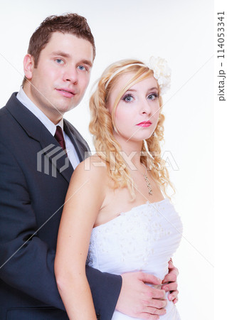 Happy groom and bride posing for marriage photo 114053341