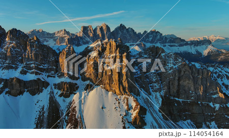 Rocky snow mountains at sunrise aerial Rocky snow mountains at sunrise aerial 114054164