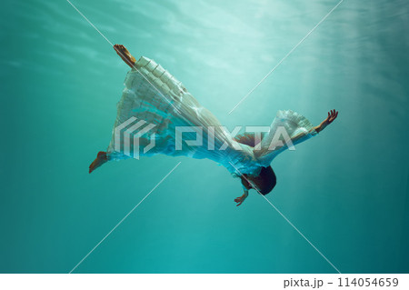 Illustration for fantasy book about magical underwater adventure. Young girl in dress levitating underwater. 114054659