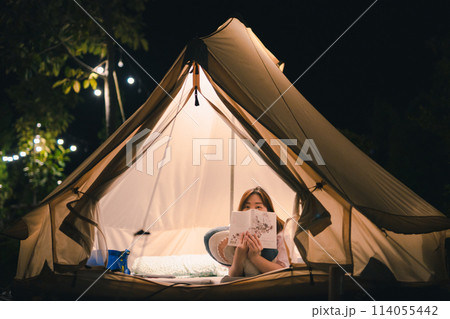 asian woman relax in camping tent on summer vacation 114055442