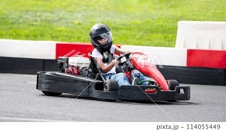 Little Girl Drives Fast Kid'S Go-Kart By Racing Track 114055449