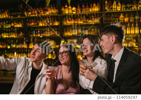 Happy couples with alcoholic drinks take photo at bar Happy couples with alcoholic drinks take photo at bar 114059297