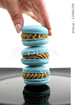 Traditional Arabic delicious and sweet desserts, candies, alfajores cookies with caramel and coconut Traditional Arabic delicious and sweet desserts, candies, alfajores cookies with caramel and coconut 114062708