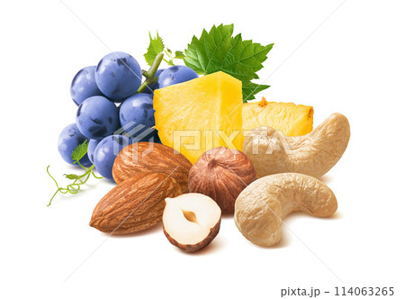 Blue grapes, pineapple, hazelnut, almond and cashew nut mix isolated on white background Blue grapes, pineapple, hazelnut, almond and cashew nut mix isolated on white background 114063265