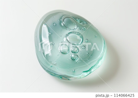 Gel. Green gel texture with bubbles swoosh swatch sample cosmetics. Cosmetic product close up. Facial jelly serum, cleanser, shower gel or shampoo. Transparent drop isolate on white background. Liquid 114066425