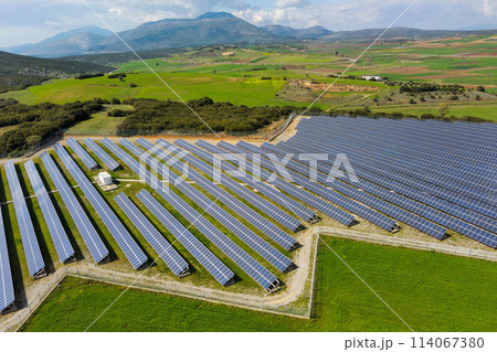 Rows of solar panels on the green meadow in Greece. Aerial view. 114067380