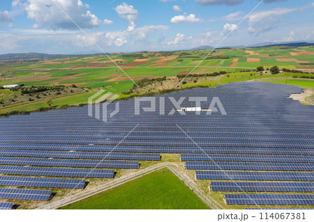 Rows of solar panels on the green meadow in Greece. Aerial view. 114067381