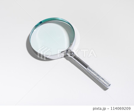 Auditor work, examining financial with magnifying glass. Fraud investigation, compliance check, tax Auditor work, examining financial with magnifying glass. Fraud investigation, compliance check, tax 114069209