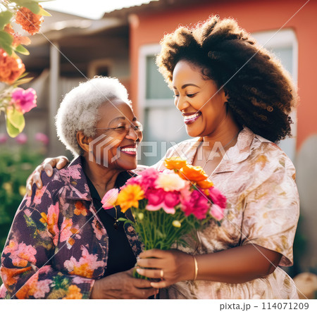 Adult daughter greeting her mother. Mother's day concept Adult daughter greeting her mother. Mother's day concept 114071209