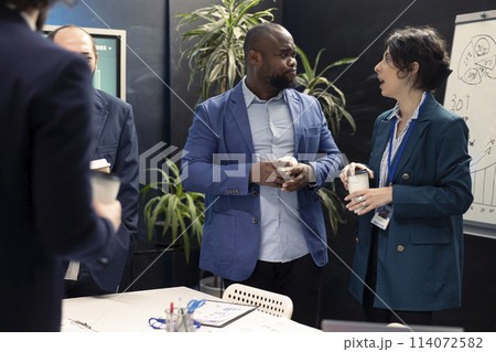 Forecast affiliates meeting in boardroom office to review latest business environment news and progress. Coworkers and general manager training to expand the enterprise globally. 114072582