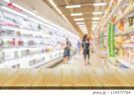 Empty wood table top with supermarket blurred background for product display 114077764
