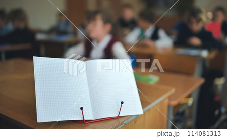 Notebook on a stand in the classroom during a lesson. Notebook on a stand in the classroom during a lesson. 114081313