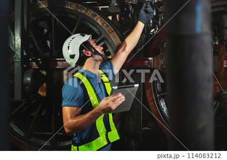 maintenance engineer working operating machines in industry factory 114083212