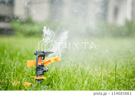 Automatic garden watering system closeup Automatic garden watering system closeup 114083861