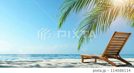 wooden sun lounger under palm tree in summer on a tropical beach 114086114