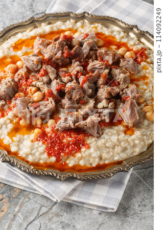 Lamb Keshkek Traditional Wheat and Mutton Stew closeup on the plate. Vertical 114092249