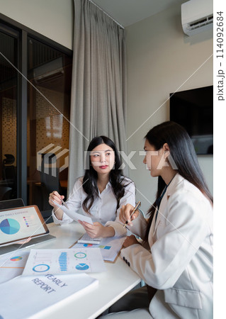 Business meeting to analyze and discuss the situation on the financial report in the meeting room. Investment Consultant, Financial advisor and accounting concept 114092684