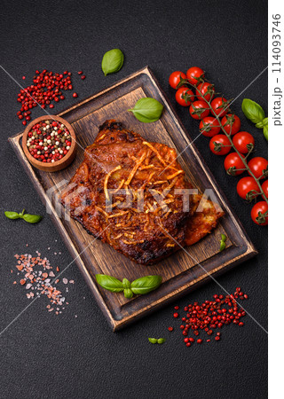 Delicious pork or beef ribs baked on the grill with salt, spices and herbs Delicious pork or beef ribs baked on the grill with salt, spices and herbs 114093746