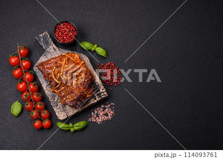 Delicious pork or beef ribs baked on the grill with salt, spices and herbs 114093761