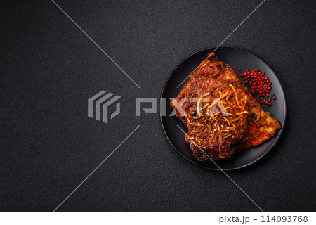 Delicious pork or beef ribs baked on the grill with salt, spices and herbs 114093768