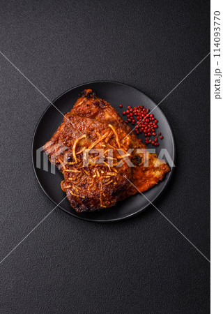 Delicious pork or beef ribs baked on the grill with salt, spices and herbs 114093770