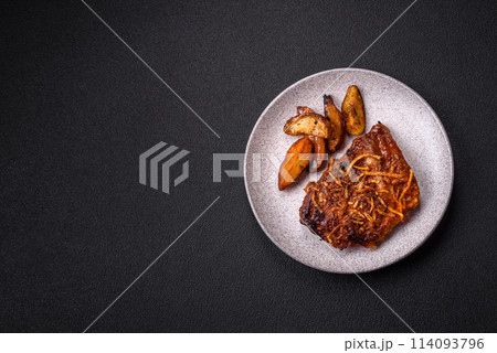 Delicious pork or beef ribs baked on the grill with salt, spices and herbs 114093796