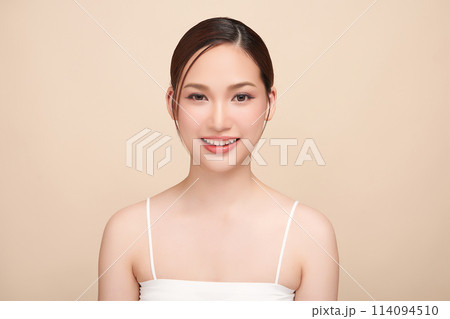 Beautiful young asian woman with clean fresh skin on beige background, Face care, Facial treatment, Cosmetology, beauty and spa, Asian women portrait. 114094510