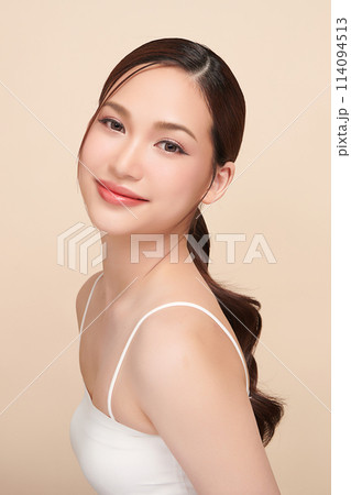 Beautiful young asian woman with clean fresh skin on beige background, Face care, Facial treatment, Cosmetology, beauty and spa, Asian women portrait. 114094513
