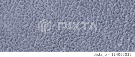 Texture of fluffy woolen cool gray textile background from soft fleecy material, macro. Structure of blue fabric Texture of fluffy woolen cool gray textile background from soft fleecy material, macro. Structure of blue fabric 114095033