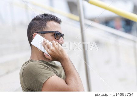 Man on call with a bike outdoors 114095754